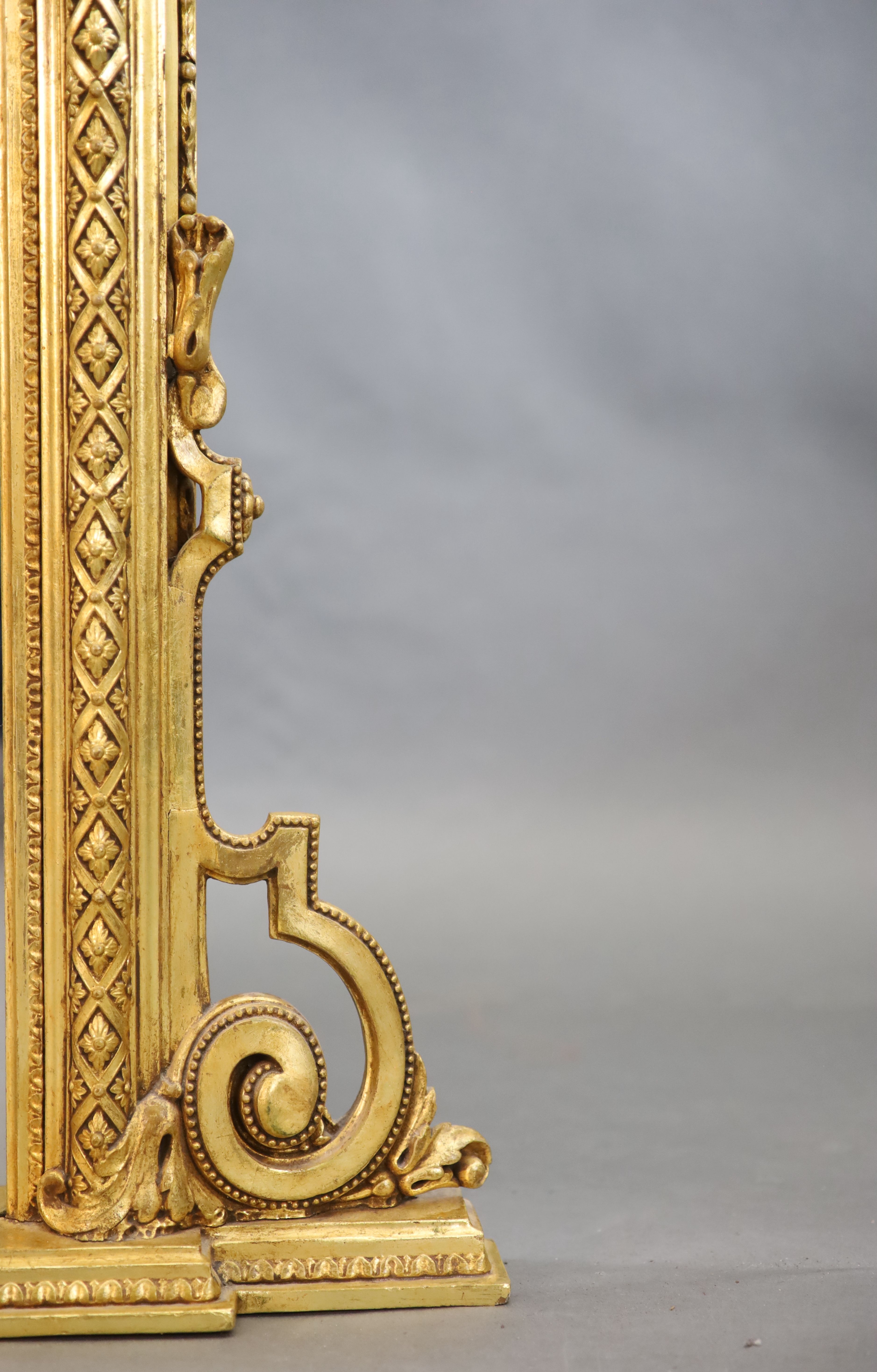 A Victorian gilt gesso overmantel W. 4ft. 6in. H.4ft. 10in.
